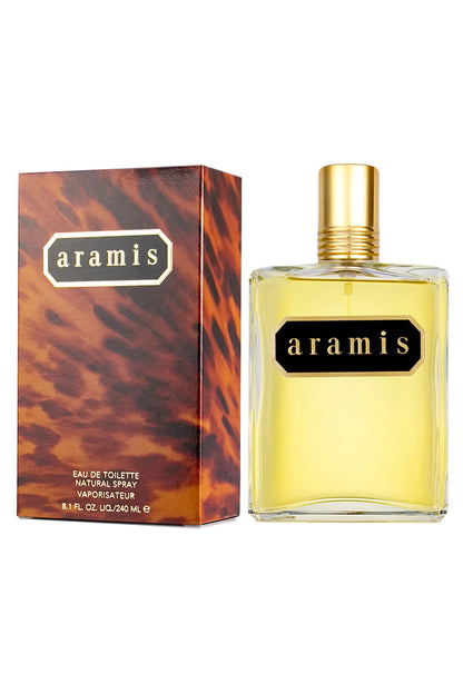 Aramis Eau de Toilette natural spray bottle with a gold cap next to its textured brown and orange patterned box, on a white background.