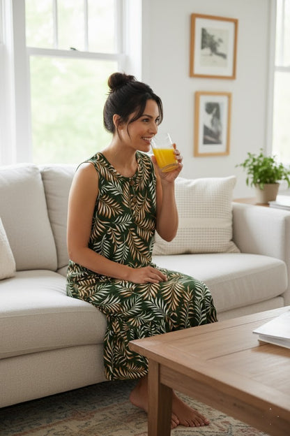 Green sleeveless tropical leaf dress